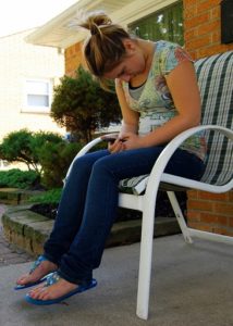 sitting female texting, posture matters