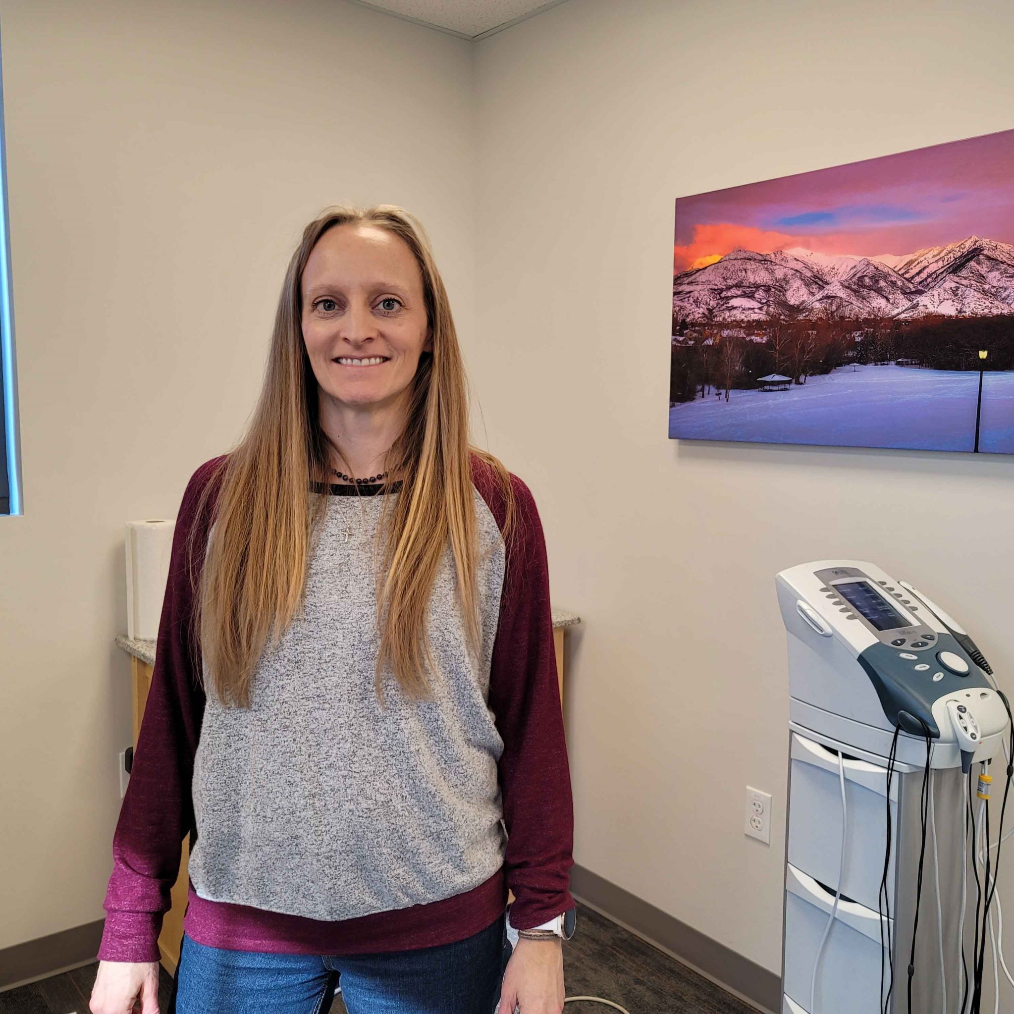 chiropractic assistant, in therapy room at Favero Chiropractic